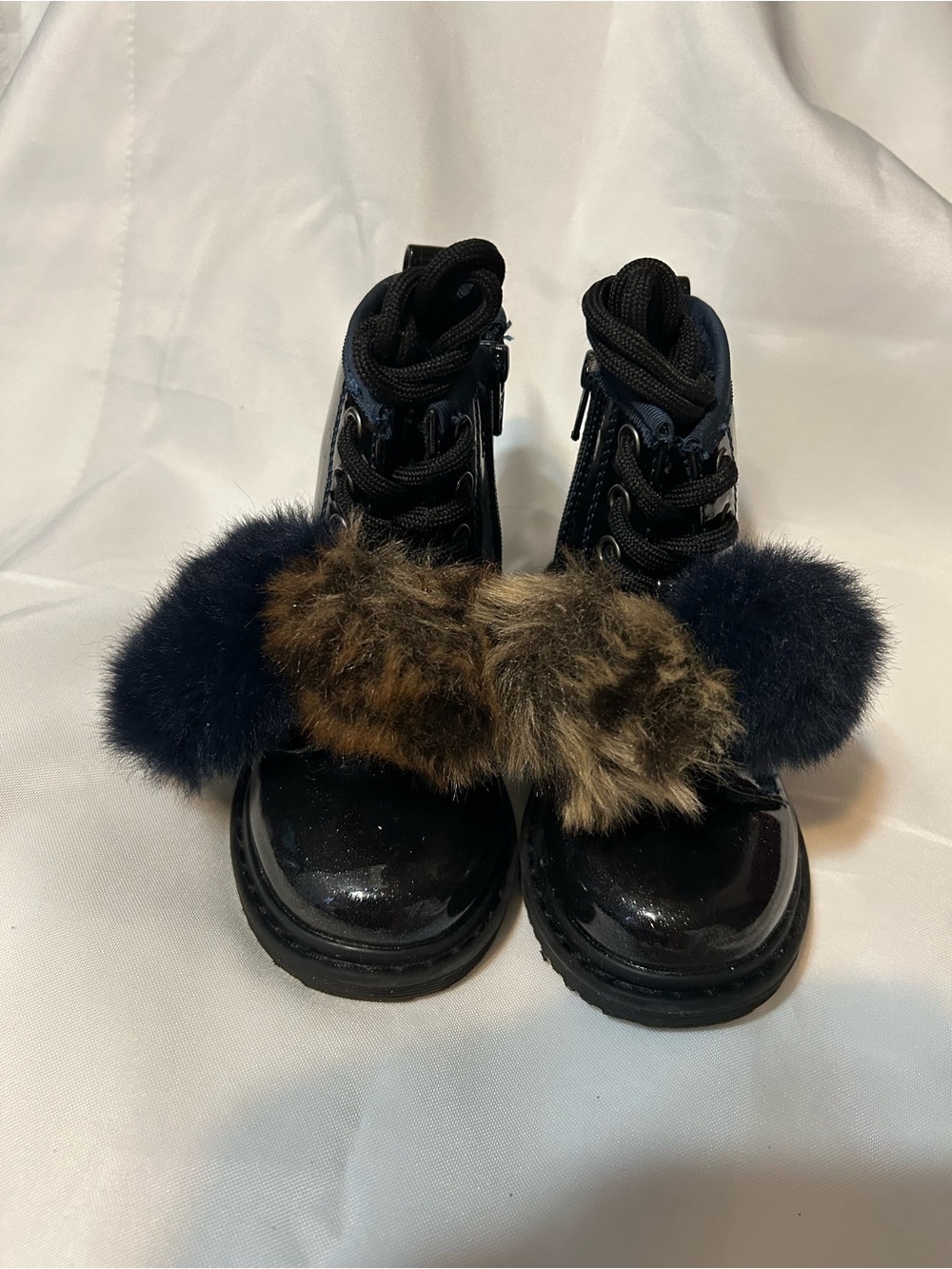 next Black Patent Kids Boots with Navy and Brown Faux Fur Pom Poms